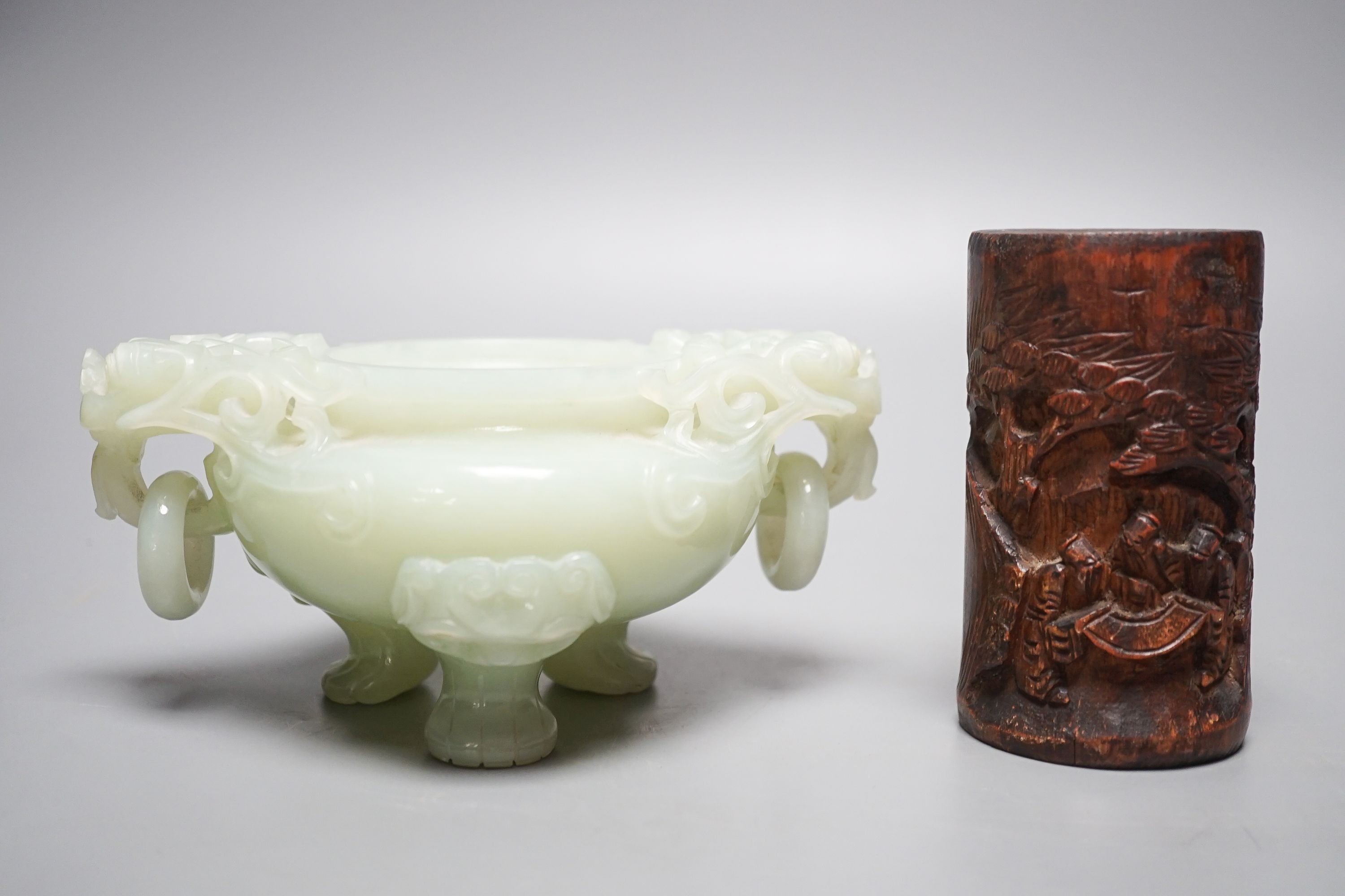A Chinese bowenite jade tripod censer, 17cm wide, a Chinese green glazed ‘duck’ water dropper and a small bamboo brush part, 19th/20th century (3)